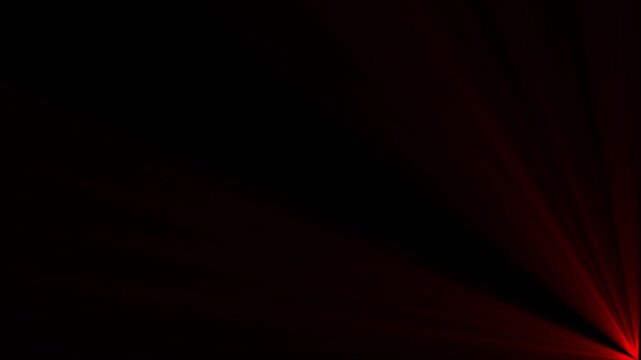 Bright red light rays emanating from the bottom right corner against a solid black background creating a soft glowing lens flare effect for overlays