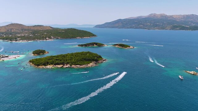 Aerial footage of Ksamil Islands, Ksamil Bay, Saranda, Albania. Ksamil is a stunning coastal village and former municipality on the Albanian Riviera, located just south of Sarand&euml;. 