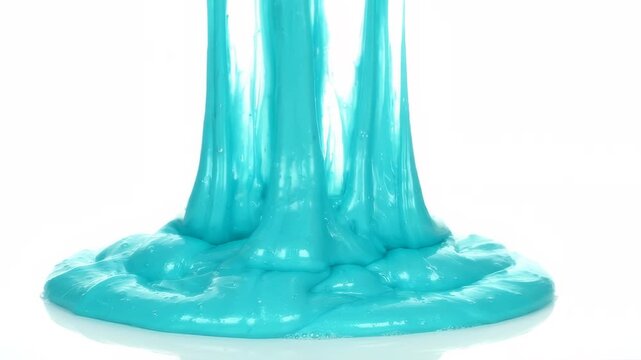 Vibrant Turquoise Slime Stretching and Flowing Downwards. Close up footage of viscous turquoise liquid plastic slime stretching and dripping with smooth motion, perfect for sensory videos.