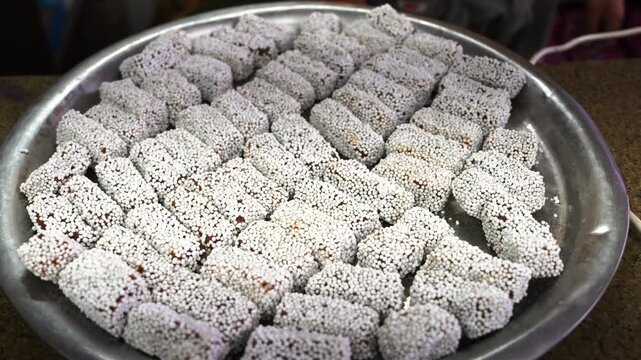 Traditional Kumaoni Bal Mithai Coated with White Sugar Pearls