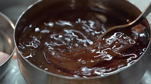 Extreme close up shot of freshly cooked Dal Tadka highlighting its rich texture and aromatic tempering.