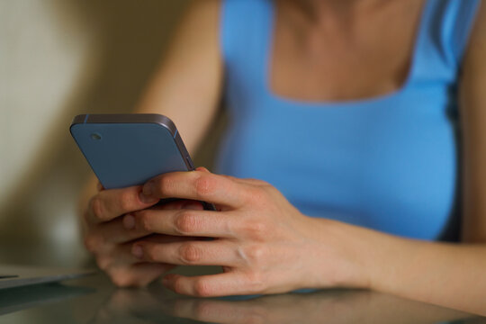 Woman using smartphone in casual attire