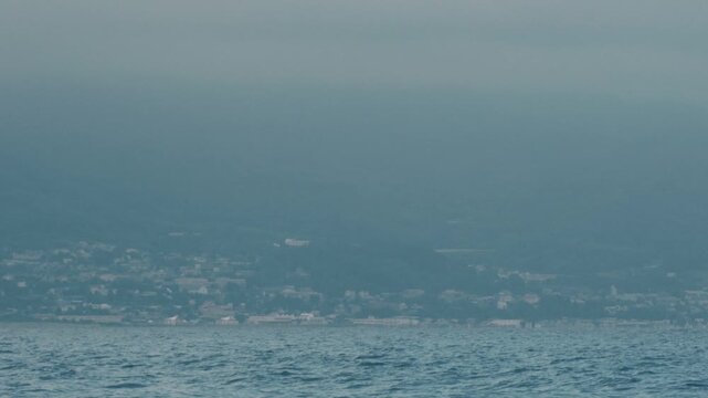 Distant Cityscape Across the Bay Viewed from an Inlet