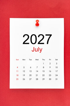 July 2027 calendar page with push pin on red color background.