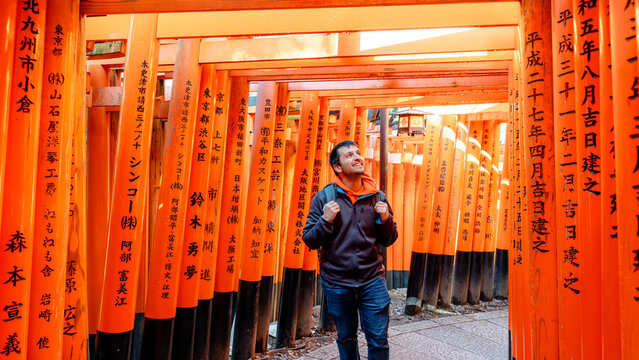 Traveler at Fushimi Inari-Taisha's thousand torii gates