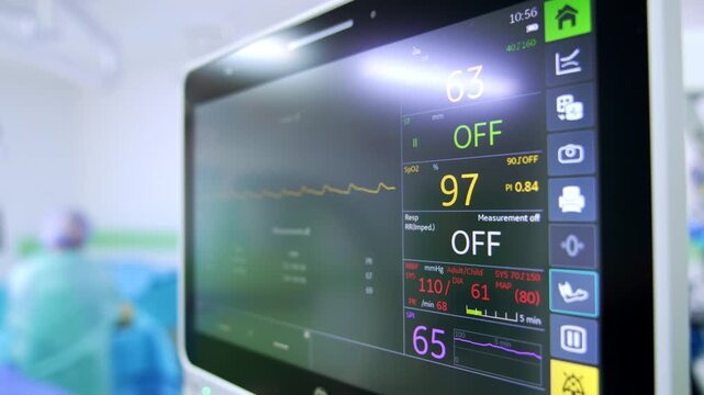 Modern monitor displays the life signs of the patient. Close up. Heart rate and pulse on the screen.