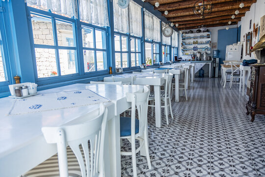 Charming mediterranean cafe interior with blue accents