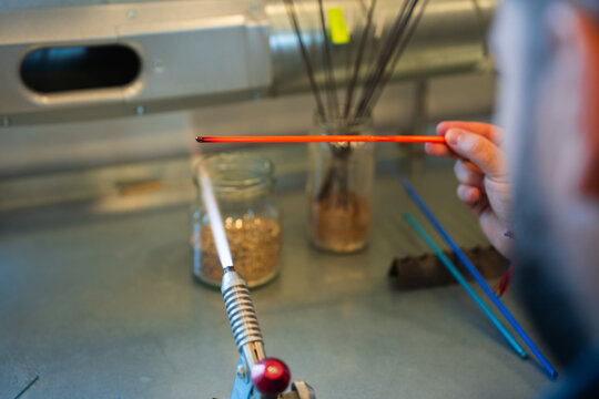 Glass bead-making process by an artisan in Lofoten