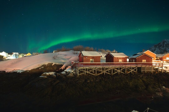 Lofoten Islands winter cabins under the aurora borealis