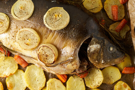 Whole roasted carp with vegetables in country style