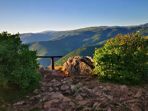 Kozji Kamen (Goat Rock) viewpoint on the scenic slopes of Stara Planina (Old Mountains) near Pirot, Serbia. A place with stunning panoramic view overlooking the winding Lake Zavoj (Zavojsko jezero).