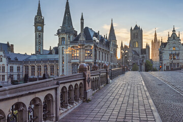 Obraz premium Ghent town in Belgium, Europe. View from Historic St. Michael's Bridge. Ancient Cityscape at Dawn with Cobblestone Street and Historic Architecture under a Clear Sky