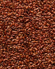 Obraz premium Flax seeds scattered on a surface in a kitchen setting during daylight hours