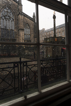 Rainy Edinburgh courtyard seen through window in Scotland