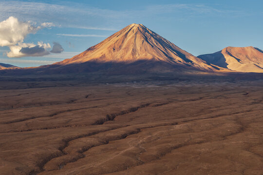 Licancabur Volcano rising over Atacama desert at sunset