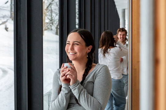 Smiling student taking a break by the window