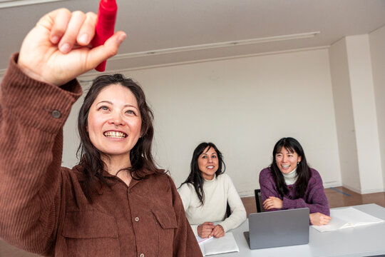 Adult Japanese lesson with teacher and smiling student group
