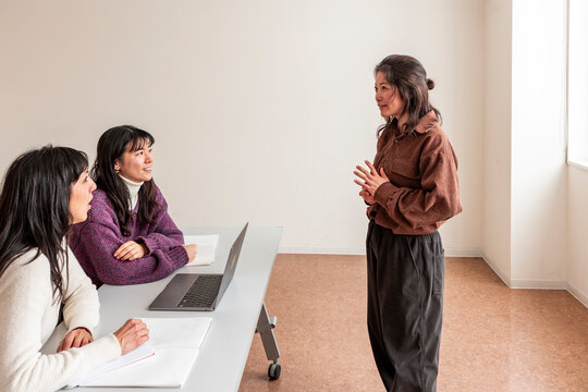 Adult Japanese lesson with teacher in small classroom