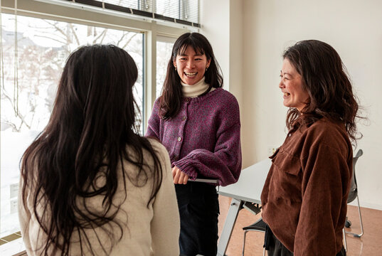 Japanese friends chatting during a classroom break