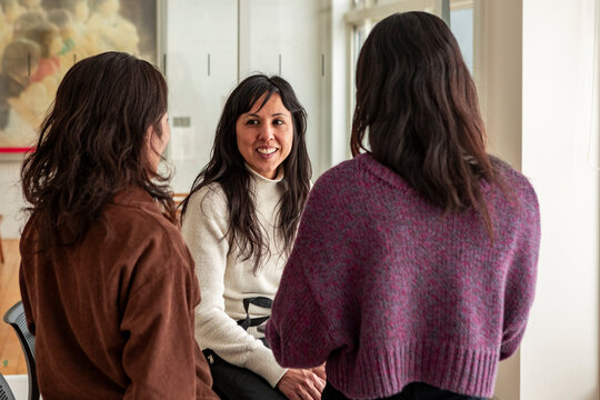 Japanese friends having a friendly conversation indoors