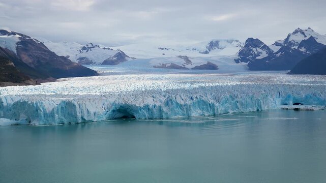 Panoramic View of the Massive Perito Moreno Glacier Face and Andes Mountains in Los Glaciares National Park. Iconic Blue Ice of Perito Moreno Glacier, Argentina