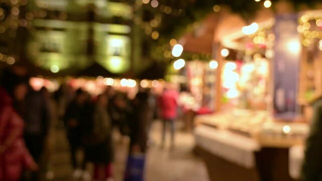 Blurred Christmas Market with Festive Bokeh and People Walking