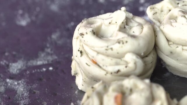 Detailed close up shot of preparing laccha paratha dough in a traditional Indian kitchen.