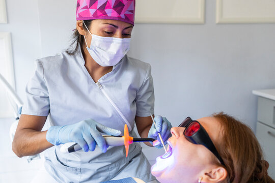 Dentist performing dental procedure on patient