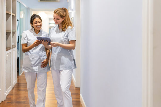 Dentists discussing patient information in clinic