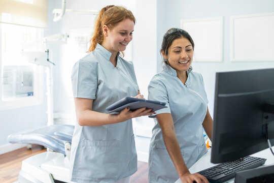 Dental professionals working in clinic reception