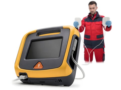 generated 3D render of paramedic holding defibrillator paddles with AED device isolated on white background