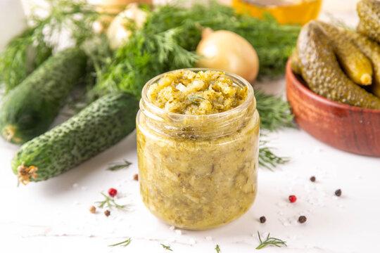 Homemade Dill Pickle Relish, tasty cucumber pickle relish condiment, with fresh cucumbers, pickles, dill, onions and spices copy space