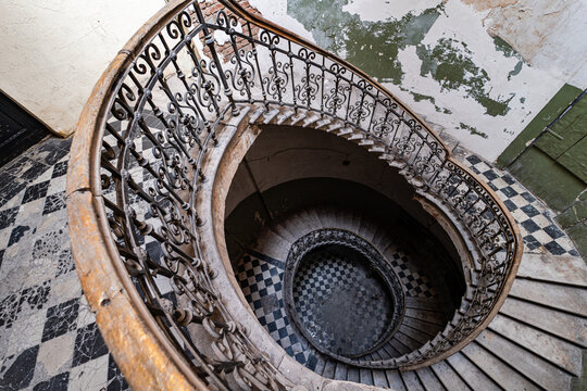 Abandoned spiral staircase in historic building
