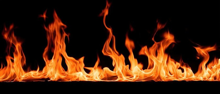 Bright orange flames flicker and dance against a black background, creating a vivid display of intense fire and heat.
