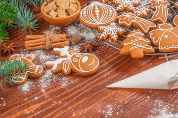 Fototapeta premium Christmas Gingerbread Cookies with Royal Icing on Rustic Wooden Background