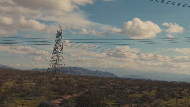 High voltage electricity pylon in a desert landscape