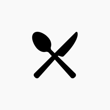 Crossed spoon and knife vector icon featuring black cutlery silhouette for restaurant, cafe, kitchen, and dining logo