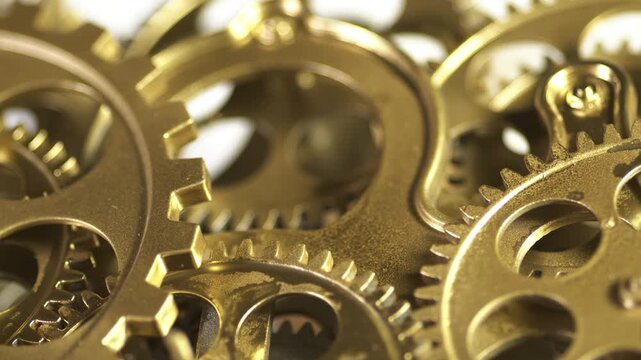 Closeup of intricate brass clockwork gears and cogs mechanism