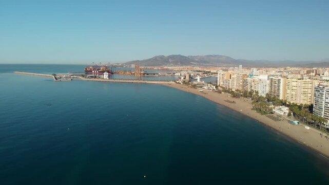 Exploring Malaga's vibrant Mediterranean coastline and bustling port, showcasing urban development and global commerce opportunities.