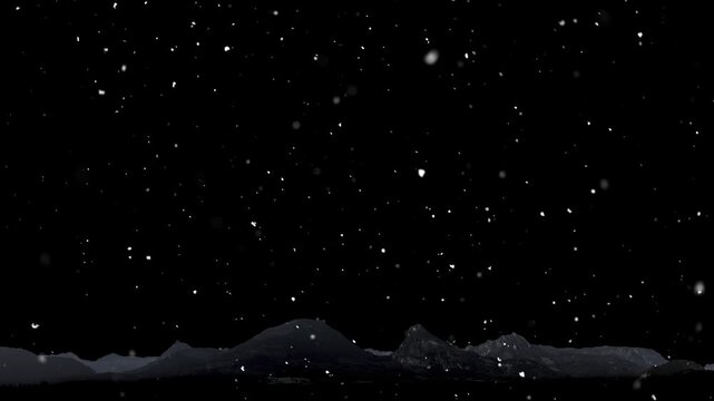 Snow is falling against the backdrop of mountains and a black background