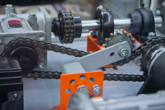 Industrial torque transmission mechanism, roller chains and sprockets for drive. Mechanical power transmission system. Drive sprockets and shafts. Drive roller chains for torque transmission. Industry