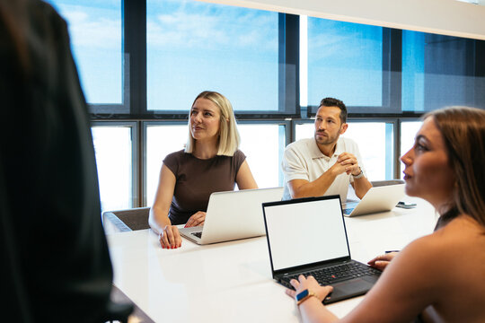 Business people collaborating in meeting analyzing data