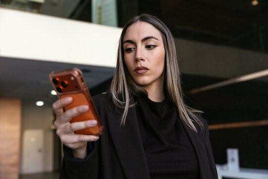 Woman browsing content on smartphone connecting online