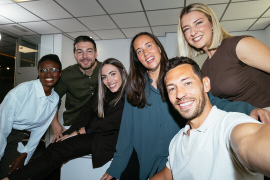 Diverse business team friends taking selfie in office