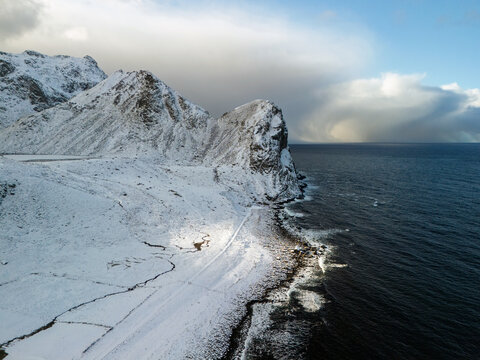 Aerial view of snowy coastline on Lofoten islands in winter 