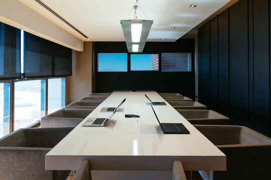 Modern conference room interior featuring long meeting table