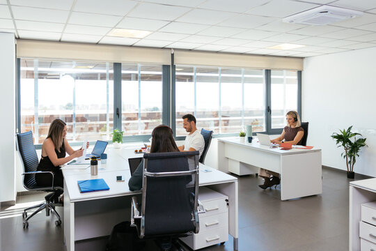 Business people working in modern coworking office space