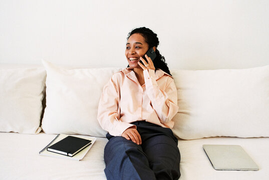 Confident Businesswoman Enjoying Casual Phone Conversation