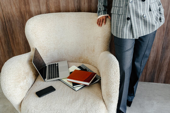 Workspace Setup with Laptop, Smartphone and Business Documents