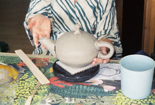 Making a Teapot From Clay in a Pottery Class at a Studio